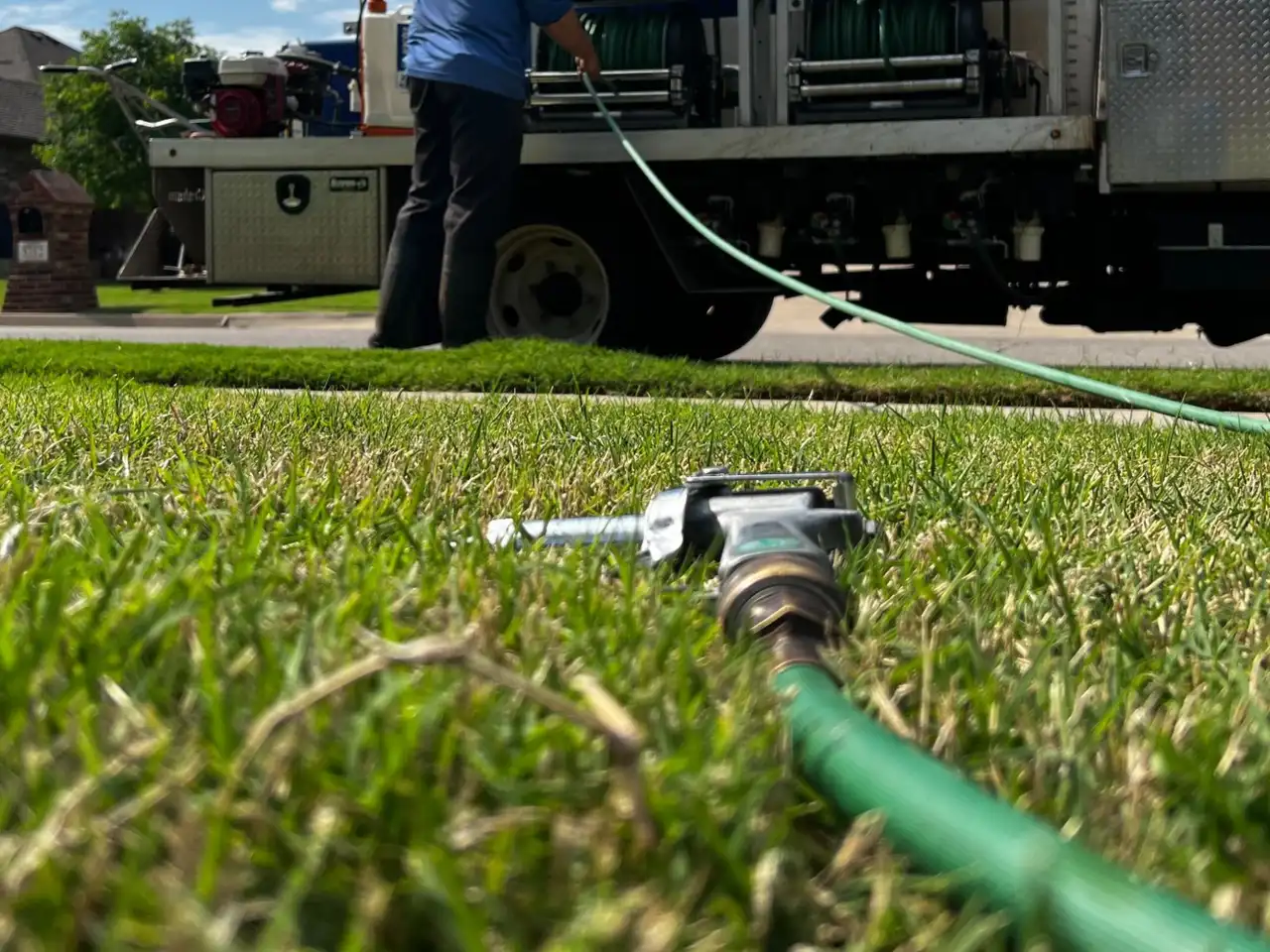 Fantastic Lawn service truck arriving to diagnose summer lawn damage on a Norman Oklahoma property