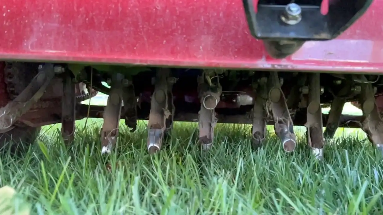 Core aeration and seeding on an Oklahoma City metro Bermuda lawn ahead of the September service window